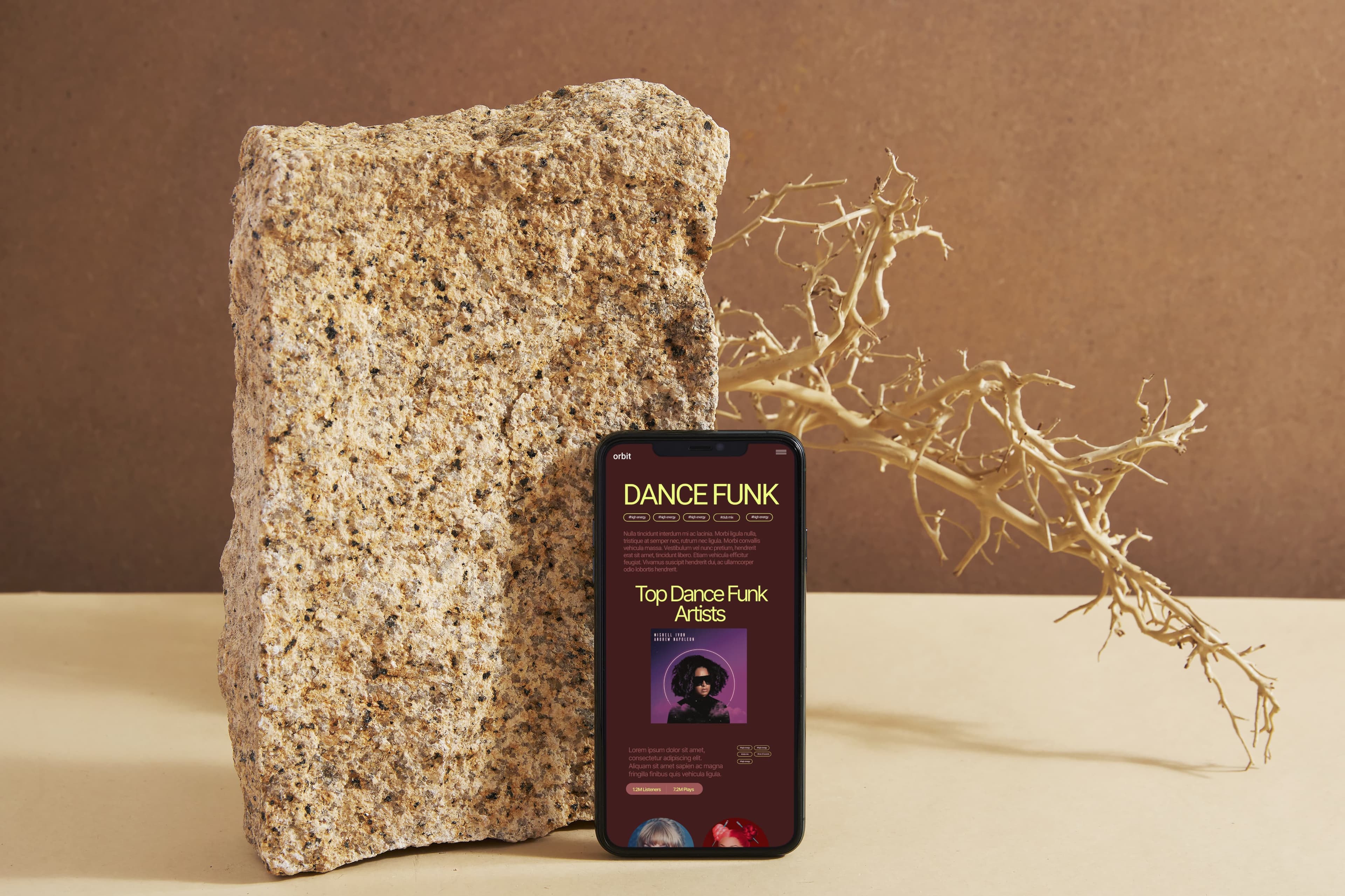 mobile phone leaned on rock