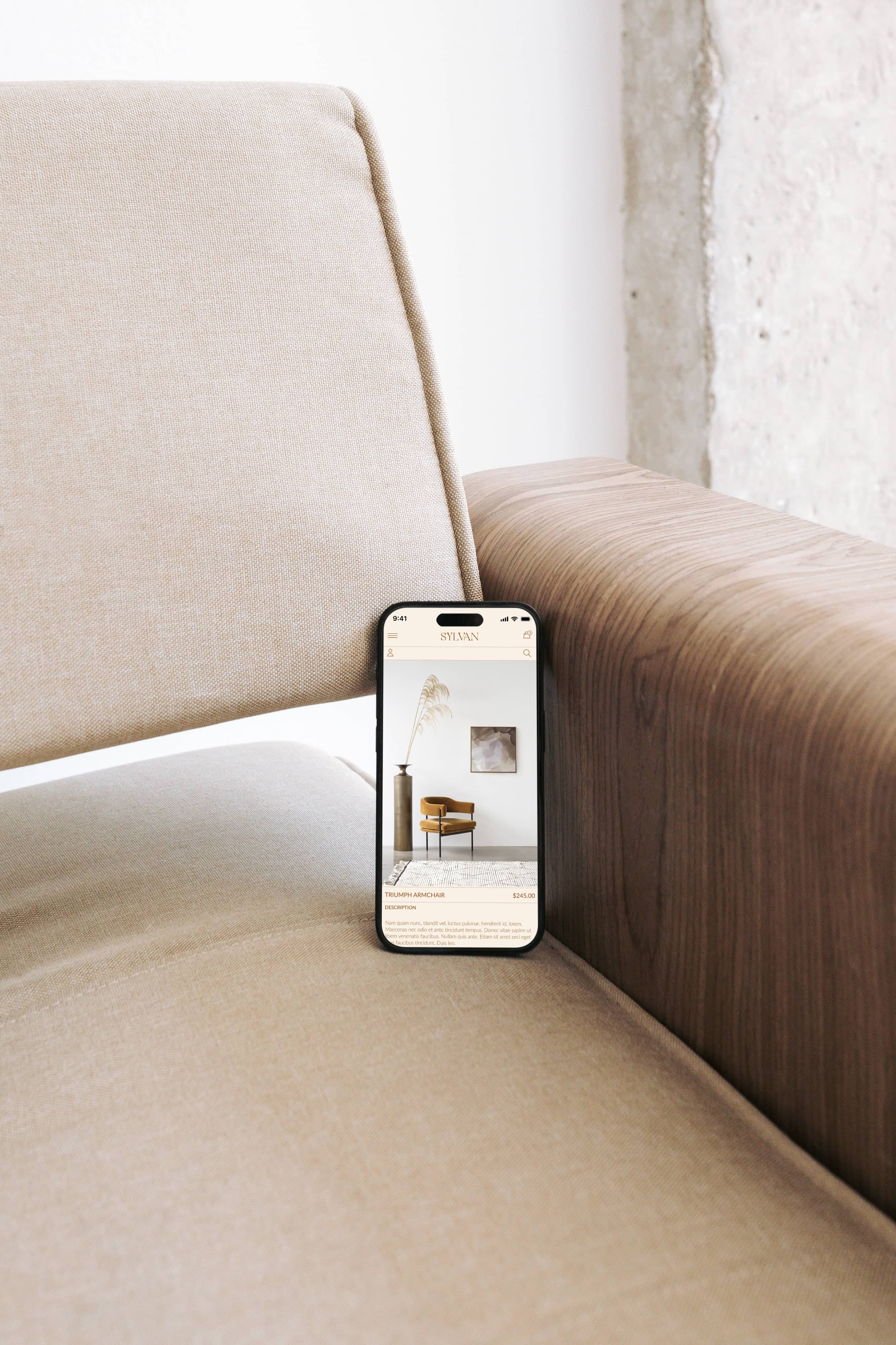mobile phone perched on the edge of elegant couch