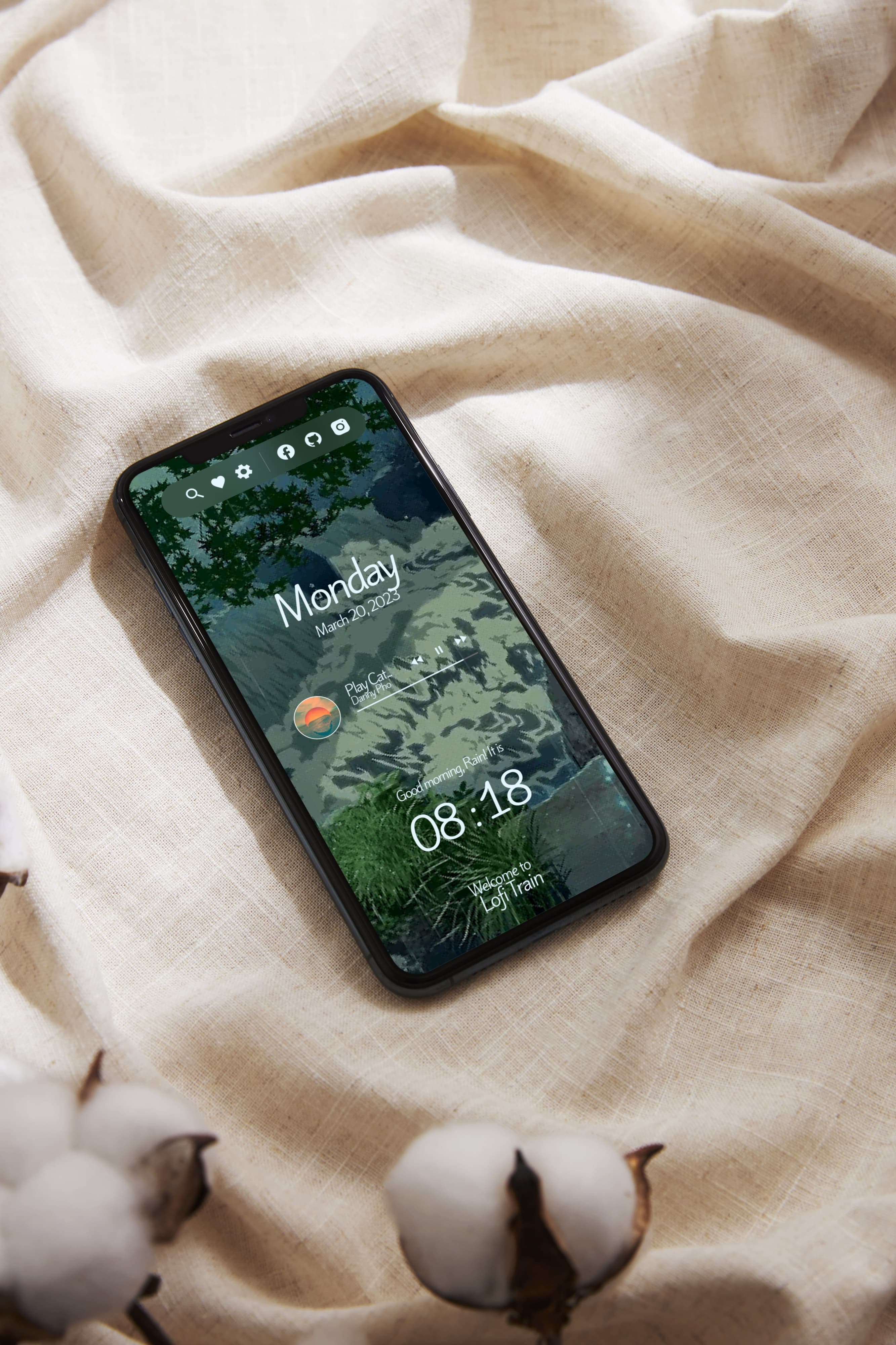 iphone lying on a soft blanket with cotton surrounding it